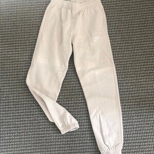Cream Nike sweatpants with elastic waistband